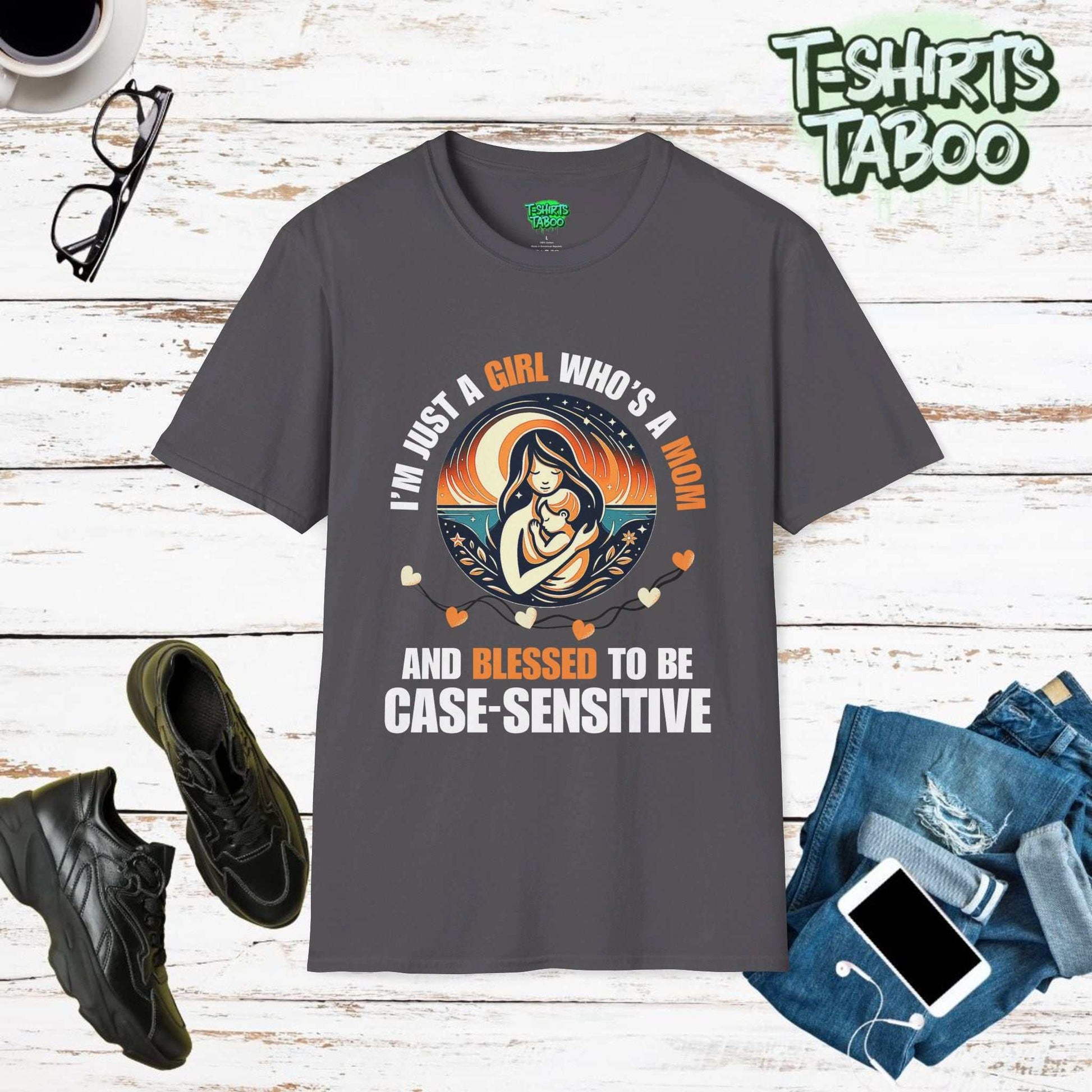 The word Case Sensitive is uniquely used in this tee by T-shirts Taboo. I'm just a girl who is a Mom and blessed to be case sensitive, A round graphic of Mom and kid