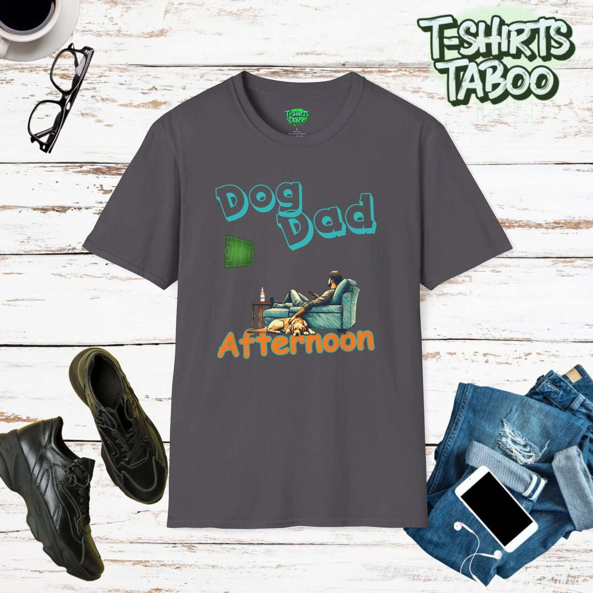 Fathers dayStylish and unique tee by T-shirts Taboo featuring the slogan Dog Dad afternoon and an image of a Dad on the sofa with a dog with him watching the football on the tv