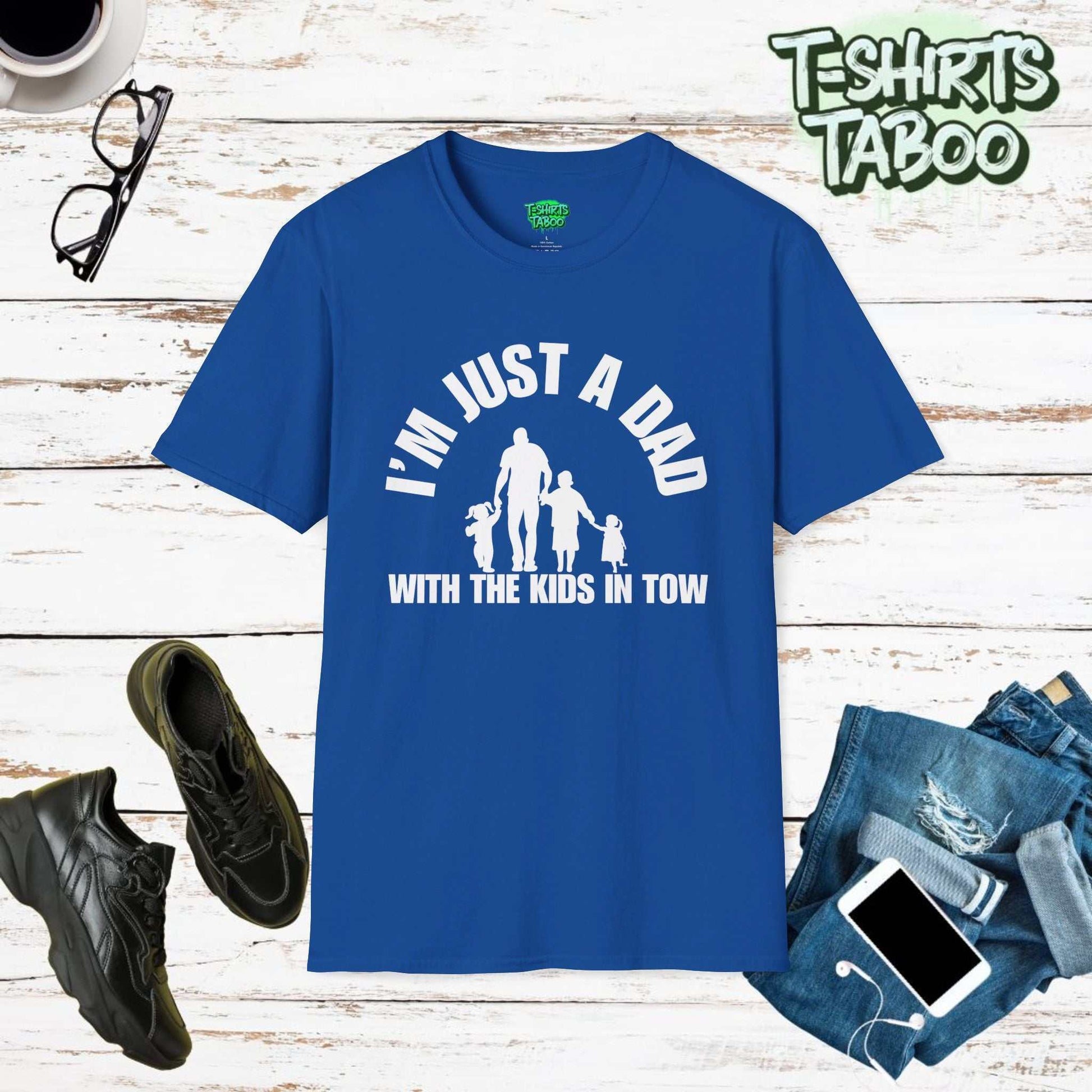 Fun tee featuring the slogan I’m just a Dad with the kids in tow.. Clear and bold statement t-shirt with a silhouette graphic of Dad walking with his kids. For dads.