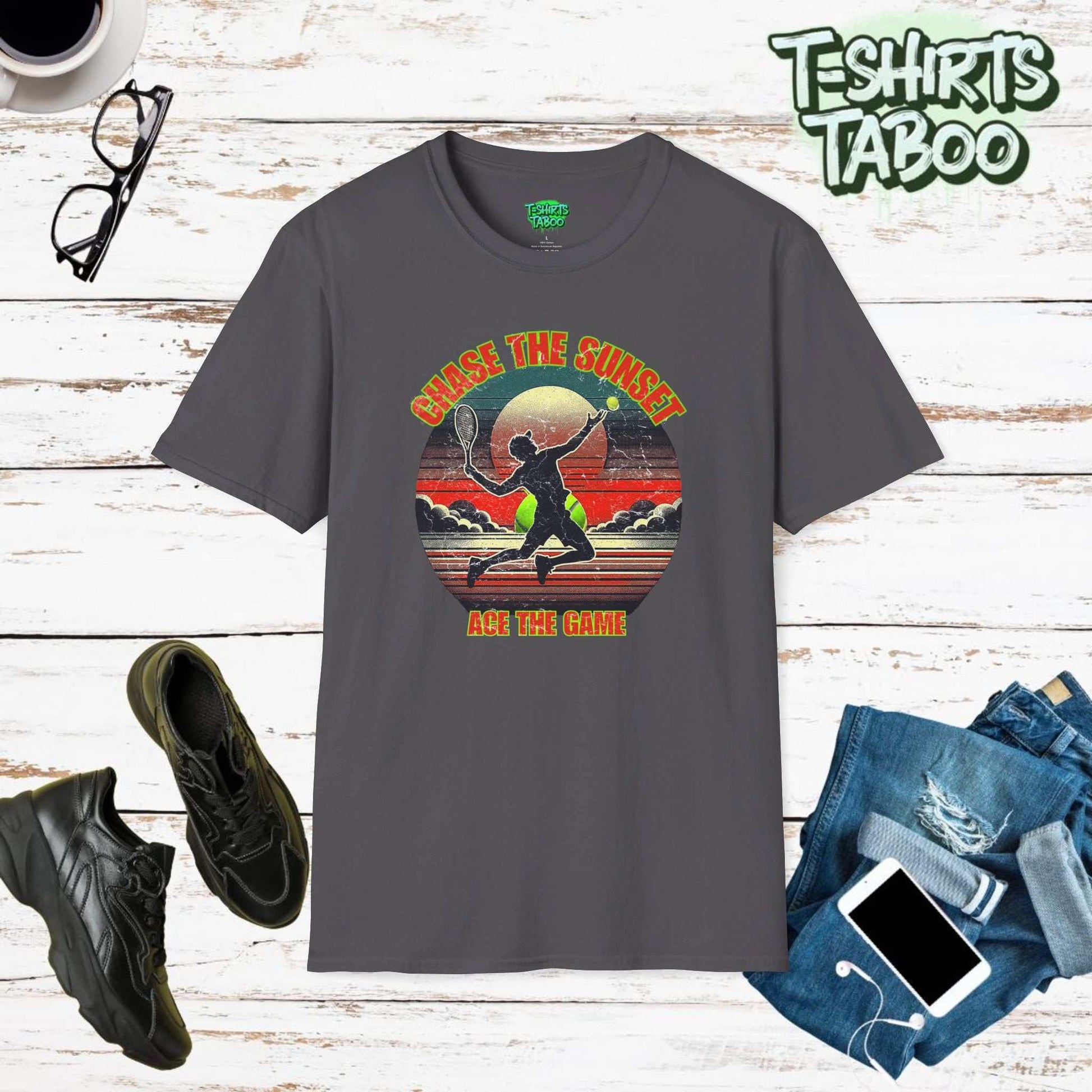 Stylish and unique tee by T-shirts Taboo with the slogan Chase the Sunset, Ace the Game, &   a silhouette tennis player serving in front of a classic sunset graphic.