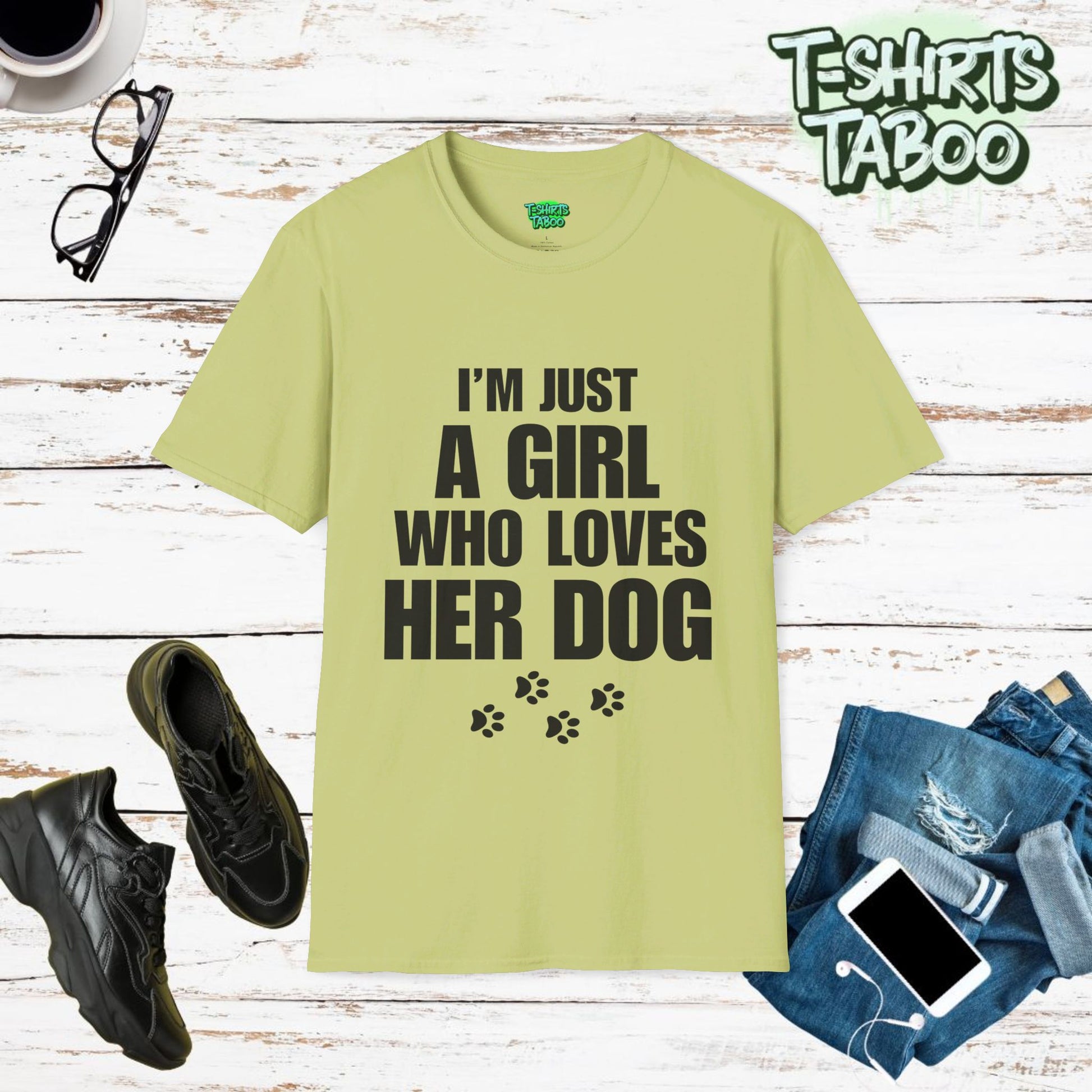 Dogs, Stylish and unique T-shirt by T-shirts Taboo showing the slogan I’m just a girl who loves her dog. Also features some paw prints graphics underneath the text.