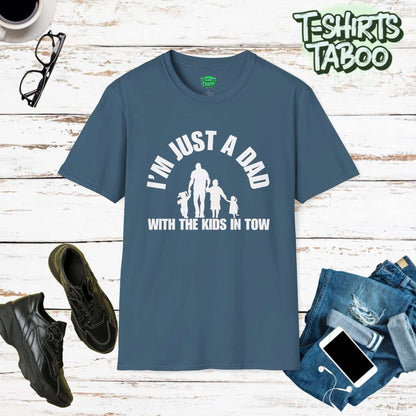 Fun tee featuring the slogan I’m just a Dad with the kids in tow.. Clear and bold statement t-shirt with a silhouette graphic of Dad walking with his kids. For dads.