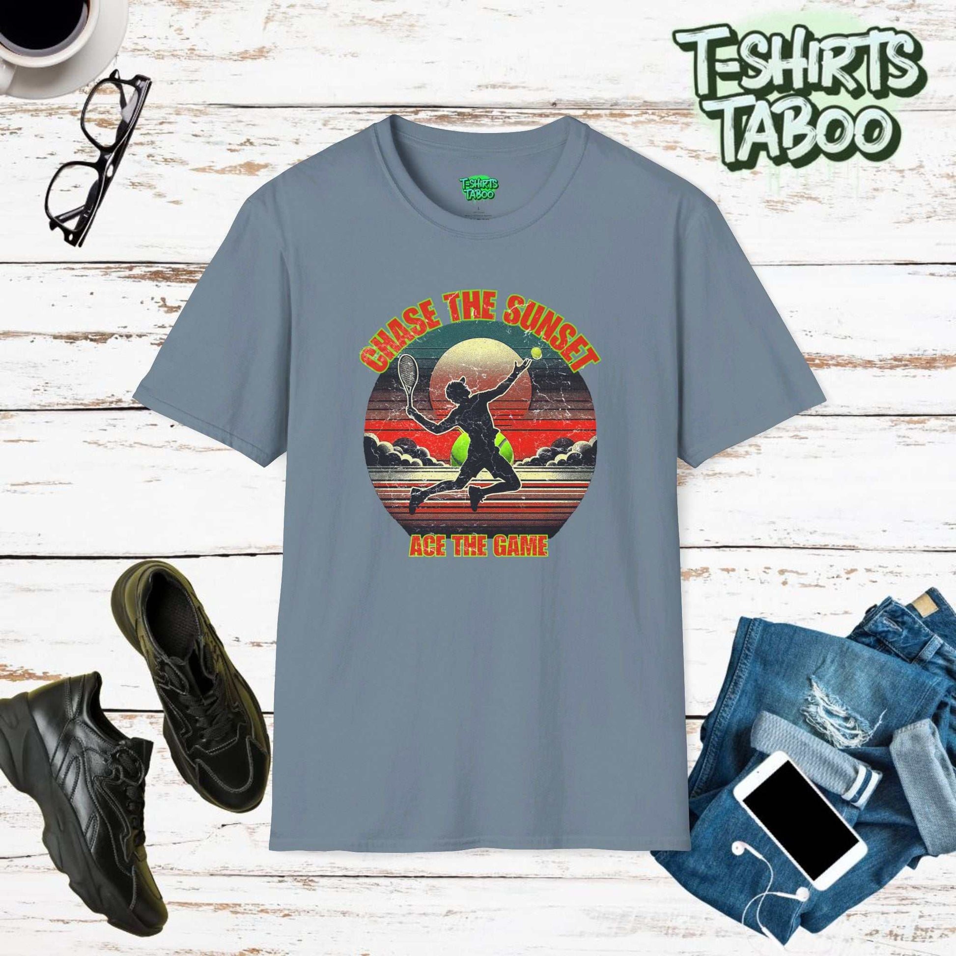 Stylish and unique tee by T-shirts Taboo with the slogan Chase the Sunset, Ace the Game, &   a silhouette tennis player serving in front of a classic sunset graphic.