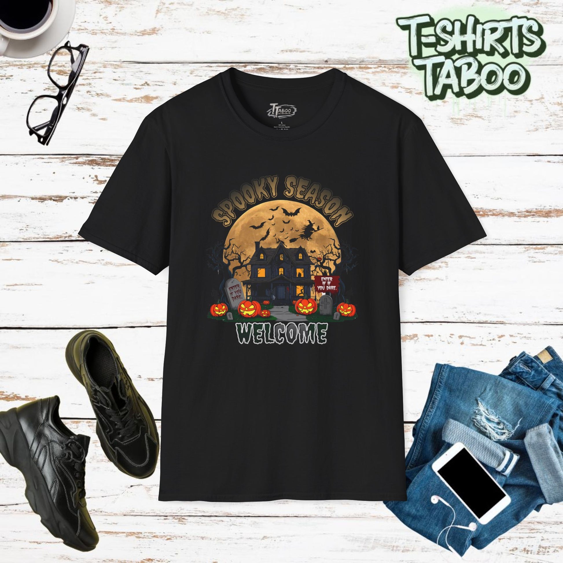 Our Halloween shirts are perfect for Halloween Costumes, this Halloween T-shirt features the text "Spooky Season Welcome" a haunted house, pumpkins and  wicked witch