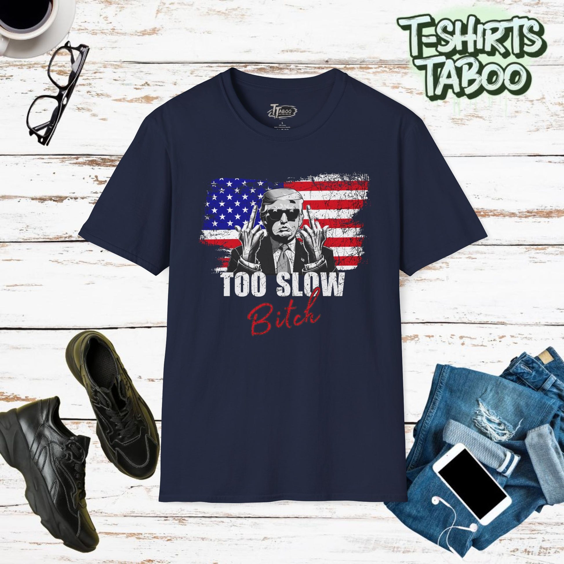 This Great You Missed Trump Shirt with this eye-catching  "Too Slow Bitch"  T shirt about a 2nd Trump Assassination of the political figure & American flag backdrop.