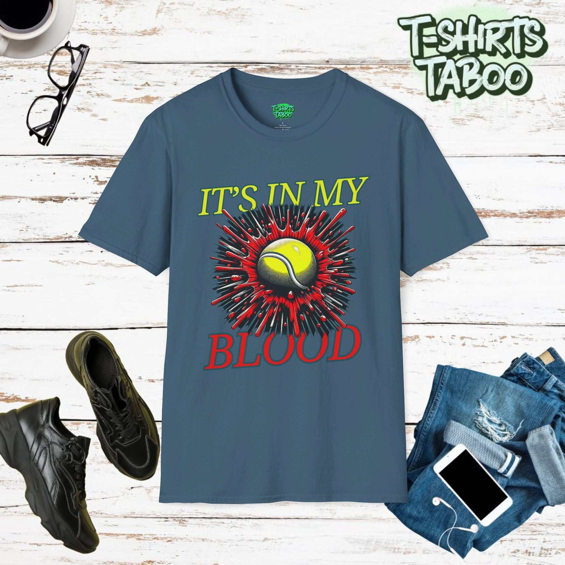 Stylish Tee by T-shirts Taboo featuring the slogan It's in my blood. Also has a graphic of Tennis ball exploding through the shirt 3d style. Perfect for Tennis fans.