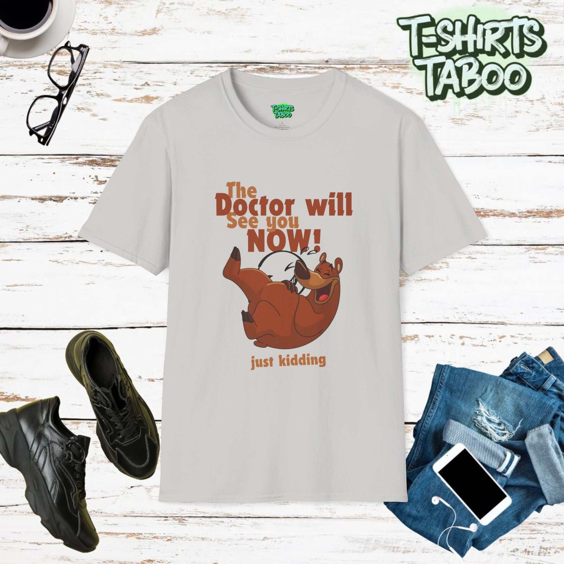 The Doctor Will See You Now t-shirt from T-Shirts Taboo features a bold slogan "The Doctor Will See You Now" prominently displayed across the front. Piss take shirt.