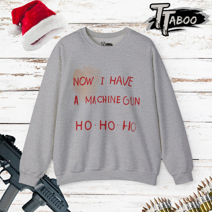 Here at t-shirts Taboo we turned that legendary scene into the most authentic Die Hard Christmas Sweater you've ever laid eyes on.  Image shows a grey christmas sweater with the words "now I have a machine gun ho ho ho"