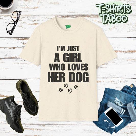 Dogs, Stylish and unique T-shirt by T-shirts Taboo showing the slogan I’m just a girl who loves her dog. Also features some paw prints graphics underneath the text.